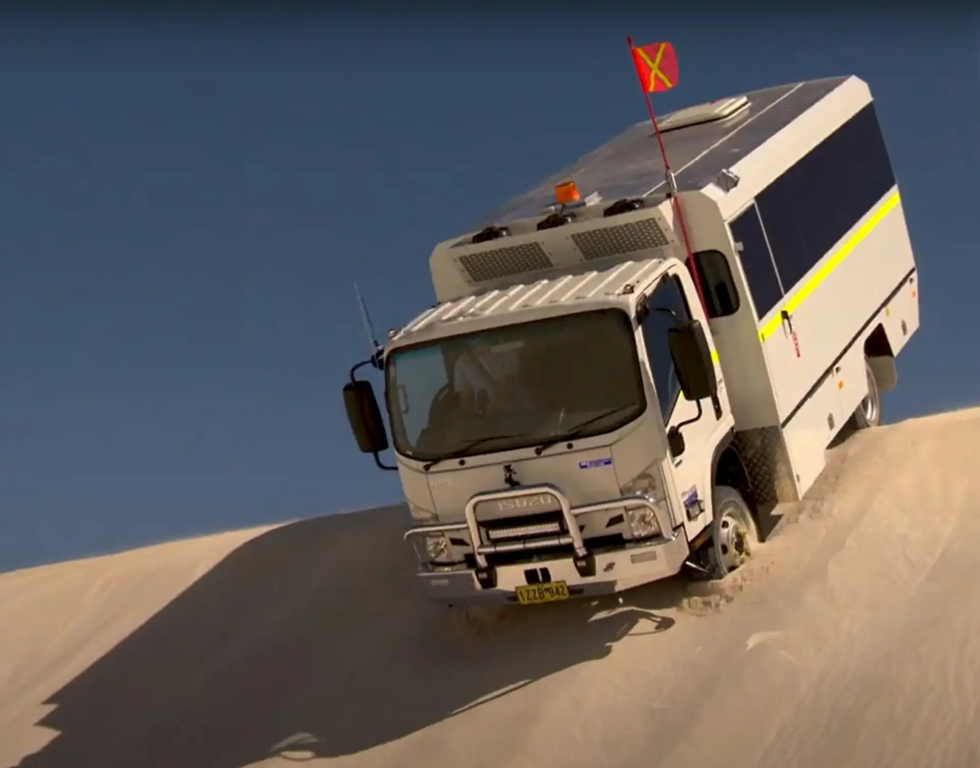 large truck going down sand dune